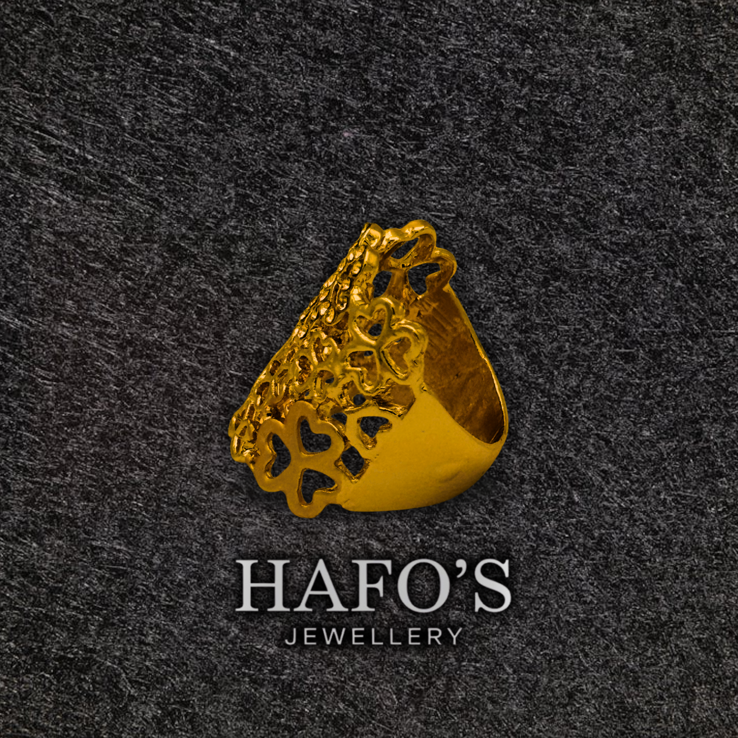 Gold ring with intricate design on a dark textured background, featuring the brand 'HAFO'S JEWELLERY'.
