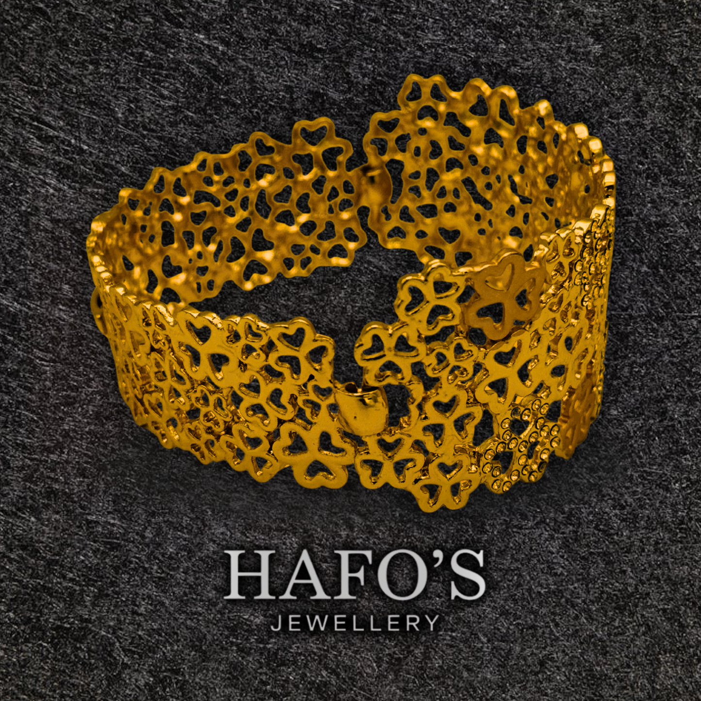 Gold bracelet with intricate design on a dark textured background, featuring the brand 'HAFO'S JEWELLERY'.