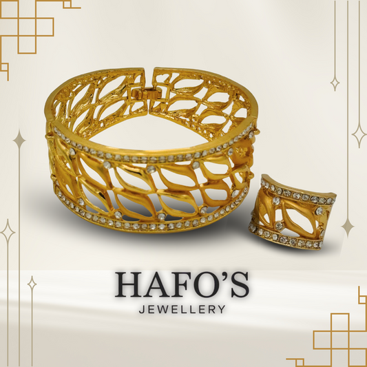 Gold bracelet with intricate design on a light beige background, featuring the brand 'HAFO'S JEWELLERY'.