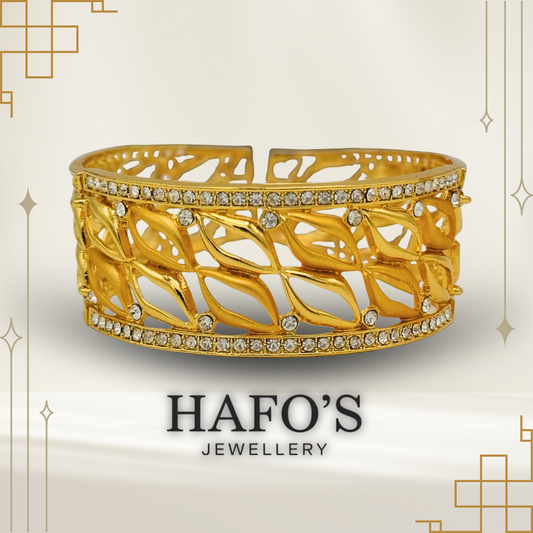Gold bracelet with intricate design and embedded stones on a light background with 'HAFO'S JEWELLERY' branding.